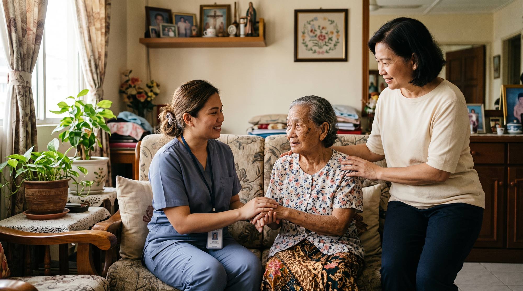 Blue Swan home-care nurse caring for an elderly parent at home in Kota Kinabalu, with family present